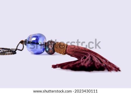 brown tassel necklace with blue murano

