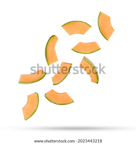 Flying fresh cantaloupe melon slices isolated on white background. Royalty-Free Stock Photo #2023443218