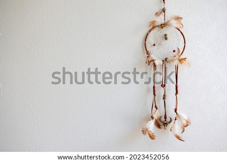 Dream catcher on the wall (left copy space)