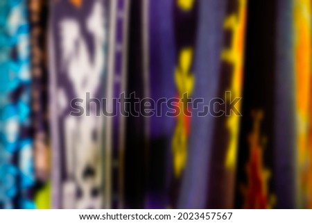 The blurry abstract background features Sika woven fabric from Flores, East Nusa Tenggara, Indonesia. This image is suitable for fashion needs and the background for a natural design with beauty color
