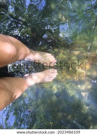Photo of woman 's feet spa in the hot water.