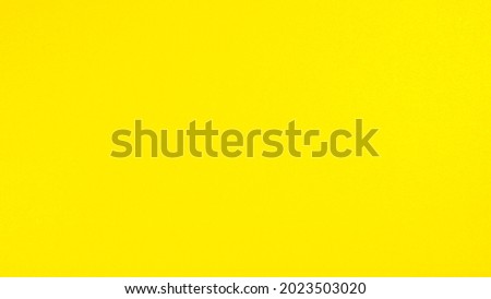 Abstract color yellow paper texture background.
Bright yellow clean blank wallpaper website.  top view.