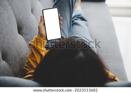 Woman using mobile smartphone and device white screen empty space smart phone, clipping path included