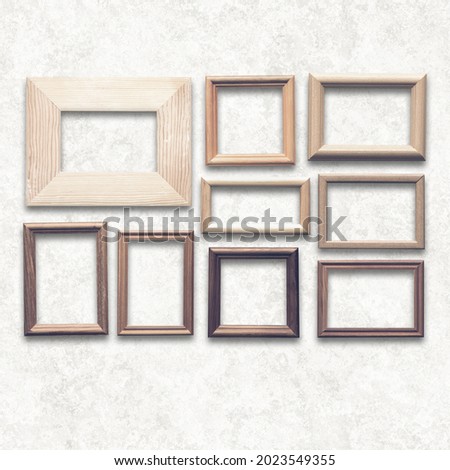 wooden photo frames on white wall