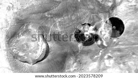 human impact,  abstract photography of the deserts of Africa from the air in black and white, aerial view of desert landscapes, Genre: Abstract Naturalism, from the abstract to the figurative, 