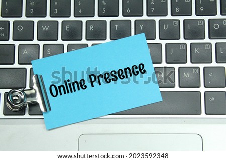 laptops, iron clamps, colored paper with the word online presence
