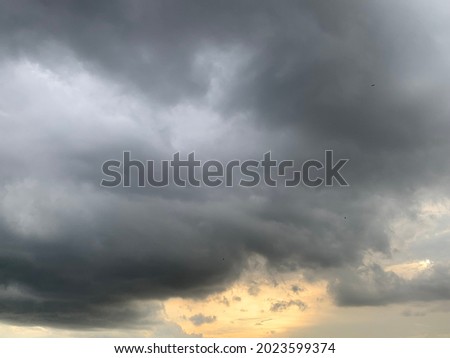 Stratocumulus cloud background Divide the dark gray and light gray into layers. There will be heavy rain in some areas and blocking the sun's rays on sky it looks beautiful.no focus