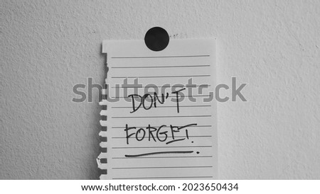 Don't forget message concept written post it on white background.	