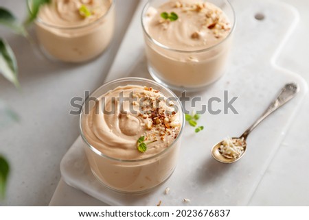 mousse dessert with chocolate paste, cheese and cream on the table Royalty-Free Stock Photo #2023676837