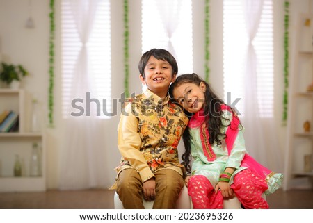 brother sister celebrating rakhi festival at home  Royalty-Free Stock Photo #2023695326