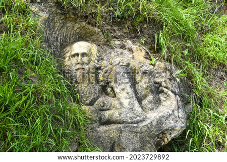 Stone sculpture depicting an old hermit. Mount San Anton, Getaria, Spain