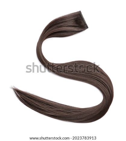 Strand of brown hair on white background