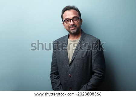 Portrait of a smiling man of Indian origin Royalty-Free Stock Photo #2023808366