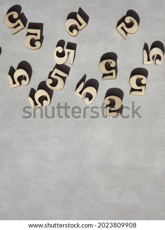the number 5 on a gray background for teaching children. High quality photo