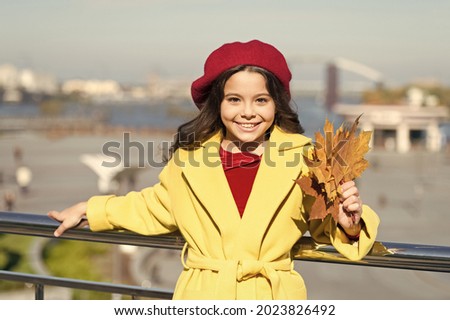 Farewell to autumn. Last autumn beams. Fall is in the air. Ideas for autumn leisure. Kid hold maple leaves. Small girl wear fall outfit outdoors. Autumn bucket list. Smiling kid collecting memories