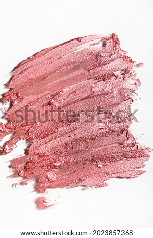 Smudged lipstick of abstract texture, top view
