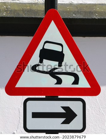 Traffic Signs UK - Slippery Surface and Arrow