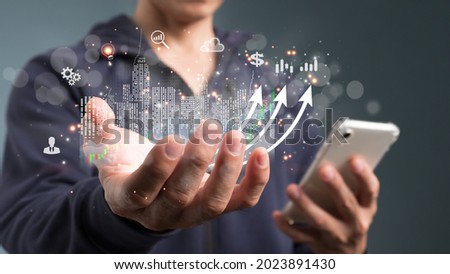 The concept is business strategy. Abstract icon. Digital marketing. Businessman using tablet analyzing sales data and economic growth graph chart.