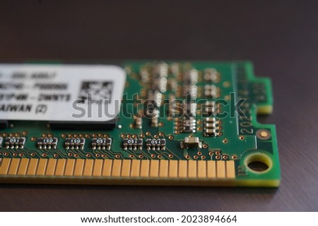 Close up macro shot of Kingston RAM memory module with pins against dark background
