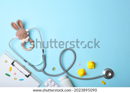 Pediatrics concept. Stethoscope and toy on a light background Royalty-Free Stock Photo #2023895090