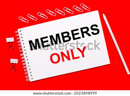 On a bright red background, a white pencil, white paper clips, and a white notebook with the text MEMBERS ONLY.