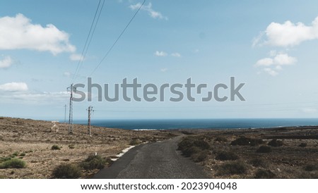 Panoramic view of dessert road to the sea