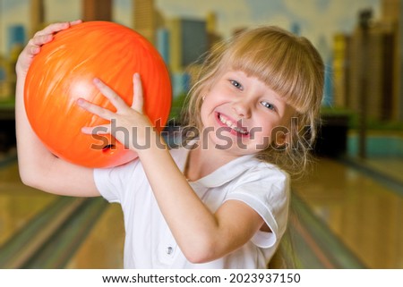 Little happy Bowling Girl in bowling center