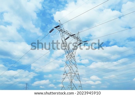 electric post with blue sky background