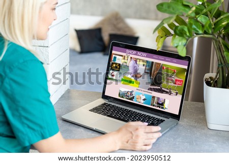 Young woman using laptop computer. Online shopping concept