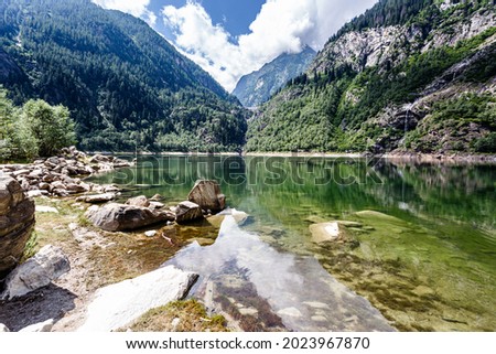 Lake Antrona is a natural lake near the homonymous town, in the province of Verbano-Cusio-Ossola. Antrona Valley, Piedmont, Italy Royalty-Free Stock Photo #2023967870