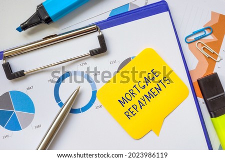 Business concept meaning Mortgage Repayments with sign on the piece of paper. 
