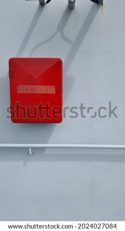 red fire hose box firefighter