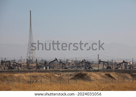 Daytime view of crude oil extraction in Bakersfield, California, USA.