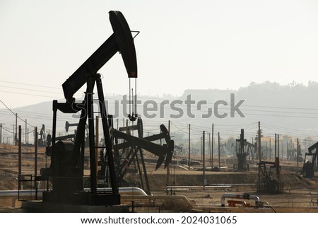 Daytime view of crude oil extraction in Bakersfield, California, USA.