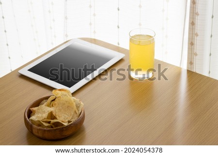 Image of eating a snack during breaks and using a tablet device