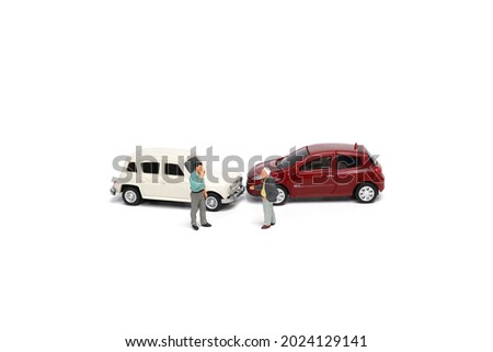 Miniature people : Two people with car crash accident scene, car insurance concept Royalty-Free Stock Photo #2024129141