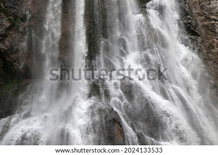 waterfall on the background of the rock