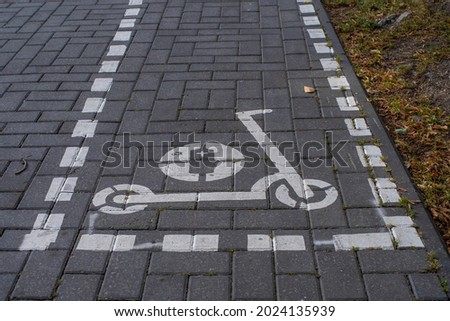 Sign painted on the pavement in a Tallinn city centre (Estonian - Kesklinn) indicating where rented electric scooters can be parked.