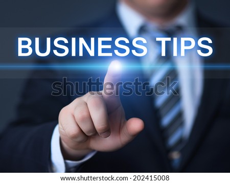 business, technology, internet and networking concept - businessman pressing business tips button on virtual screens 