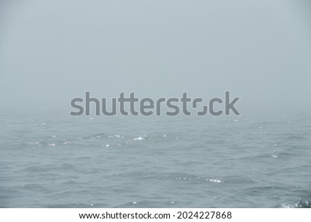 The sea in the fog. The line of the horizon, dissolving in the mist. Irish sea in fog. Foggy weather 