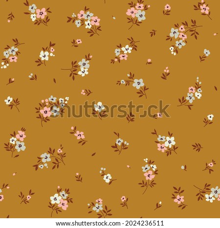 Vintage floral background. Floral pattern with small pastel color  flowers on a yellow mustard background. Seamless pattern for design and fashion prints. Ditsy style. Stock vector illustration. Royalty-Free Stock Photo #2024236511