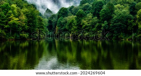 Reflections of late summer,  Stonewall Jackson Lake Wildlife Management Area, Near Roanoke, West Virginia, USA Royalty-Free Stock Photo #2024269604