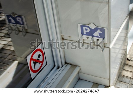 Dog parking sign. Dogs not allowed sign on a store exterior