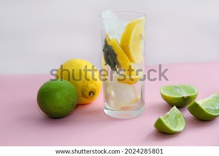 glass of lemonade with lemon lime and mint