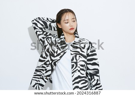 Portrait of fashionable young Asian woman
