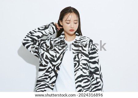 Portrait of fashionable young Asian woman