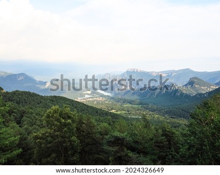 Panoramic view of the pre-Pyrenean area of Catalonia, with the Sierra Cadí, Llosa del Cavall pond and the small town of San Lorenzo de Morunys. Catalonia, Spain