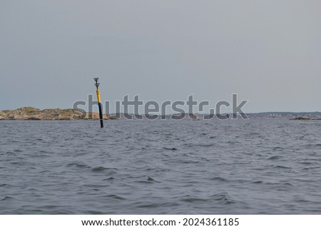 South cardinal mark black and yellow buoy at sea used for maritime navigation (horizontal picture)