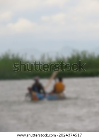 Blurred soft a fishermen who are looking for fish in the afternoon