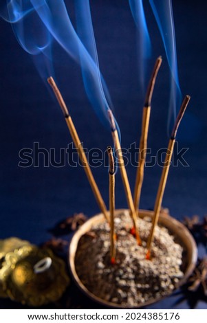 GOIÂNIA GOIAS BRAZIL – AUGUST 13 2021:  Friday 13. Some incense lit emitting a fragrant smoke with the intention of purifying the place.